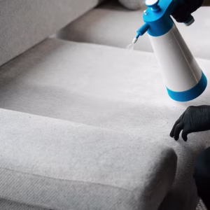 spraying-detergent-wash-off-stains-from-sofa-cleaning-furniture-home-with-spray-detergent_255847-12832